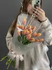 Купить Букет из 19 персиково-желтых тюльпанов в оформлении в Томске